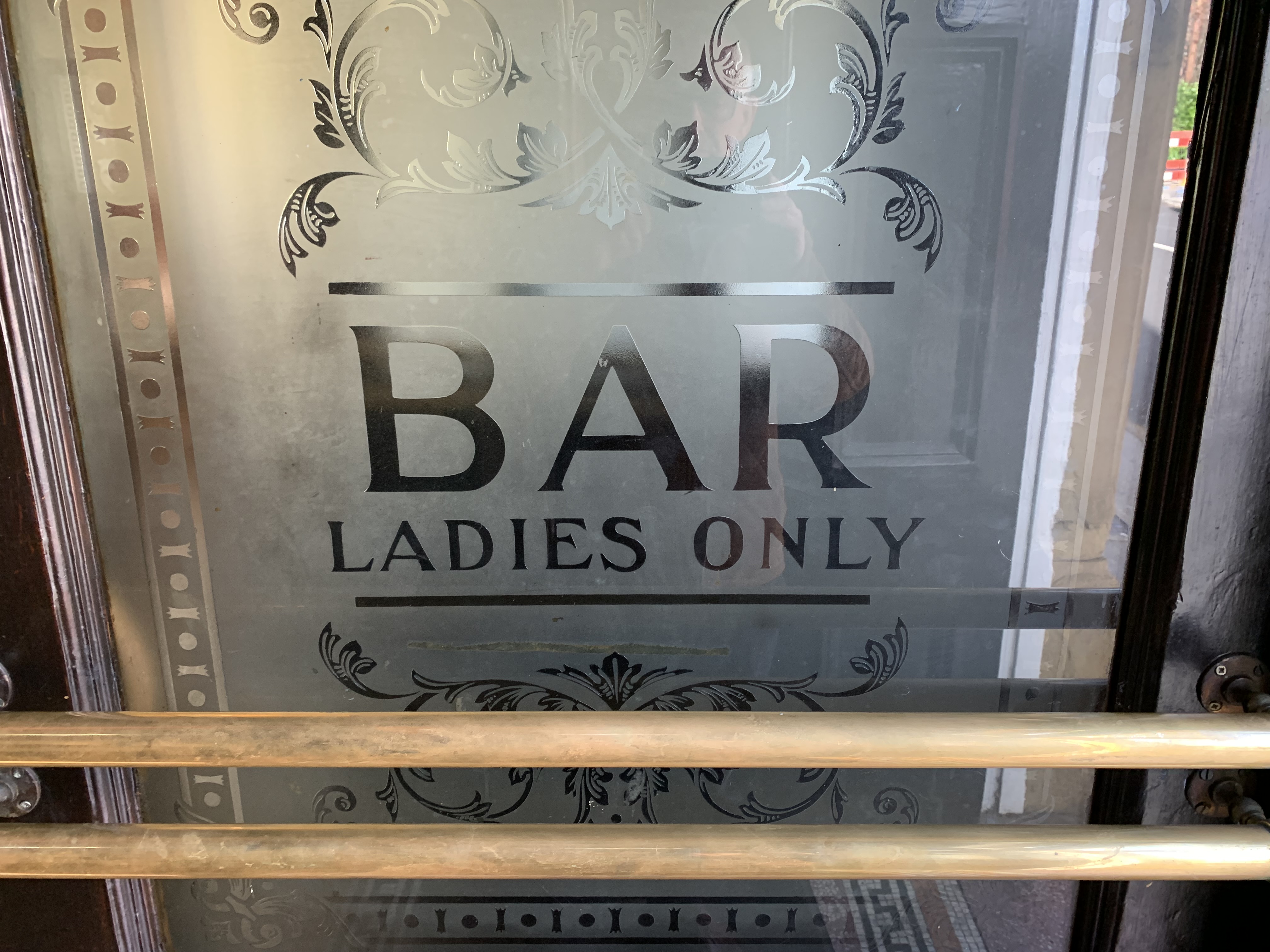 Etched glass from former ladies only room.  by David Sherliker